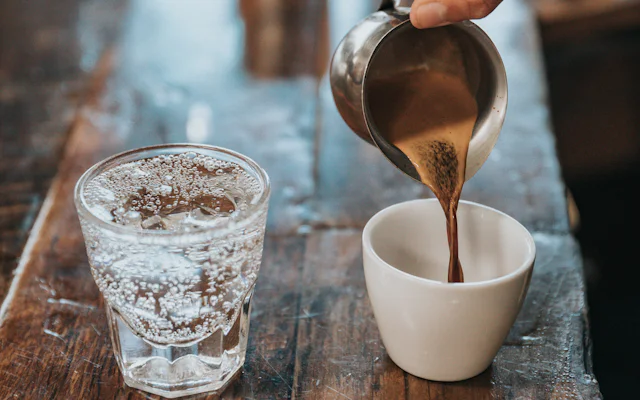 Coffee being poured into a mug